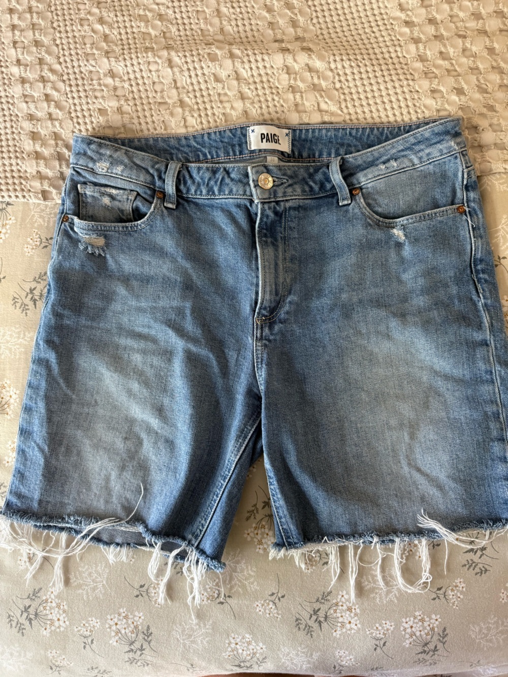 PAIGE Medium Blue Frayed Hem Denim Shorts